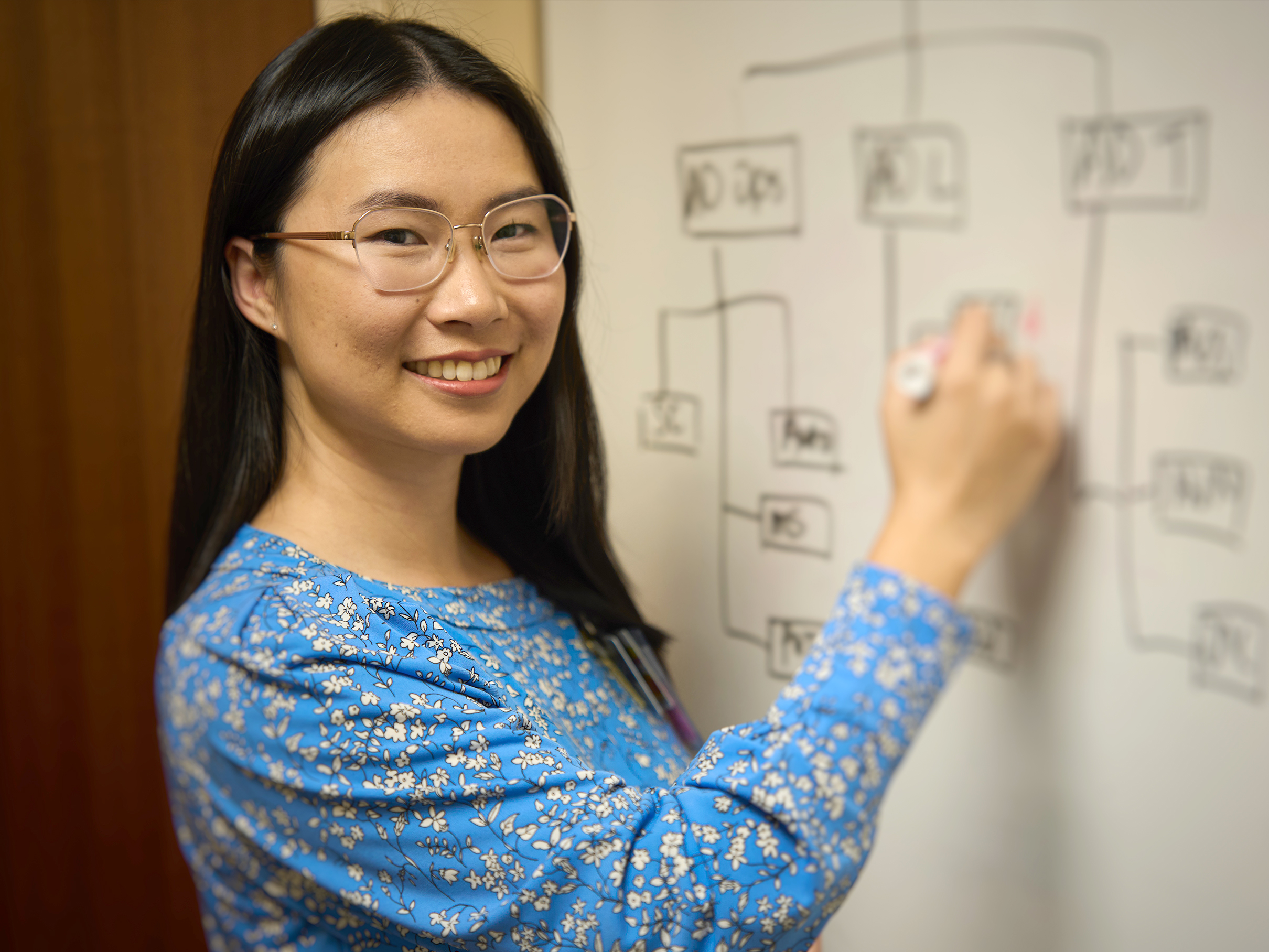 Yujing Steenwyk Writing on Whiteboard